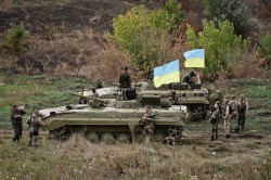 Киев заявил о начале отвода легкого вооружения Киев заявил о начале отвода легкого вооружения