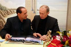 Путин и Берлускони занялись бизнесом Путин и Берлускони занялись бизнесом